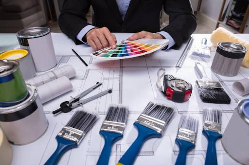 Architect's Hand Choosing Color from Swatch stock photo