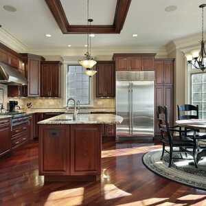 Contemporary brown kitchen with cherry cabinets and brown floor