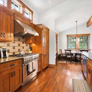 The brown cabinets and brown hardwood floors