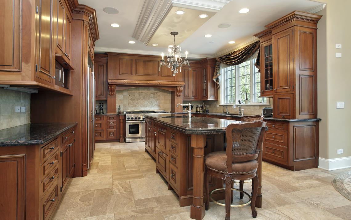 Brown u-shaped kitchen with brown cabinets