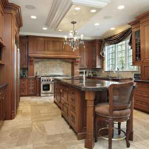 Brown u-shaped kitchen with brown cabinets