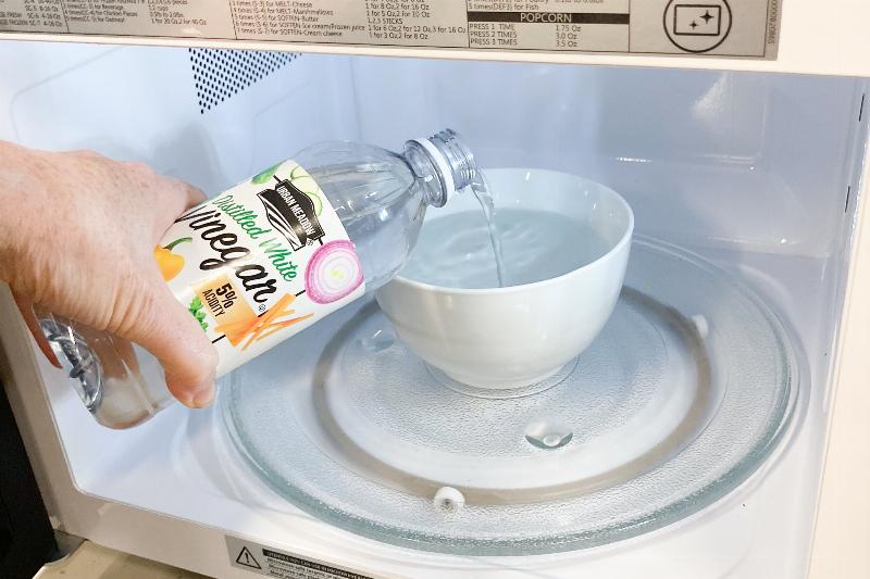 Clean a microwave with water and vinegar