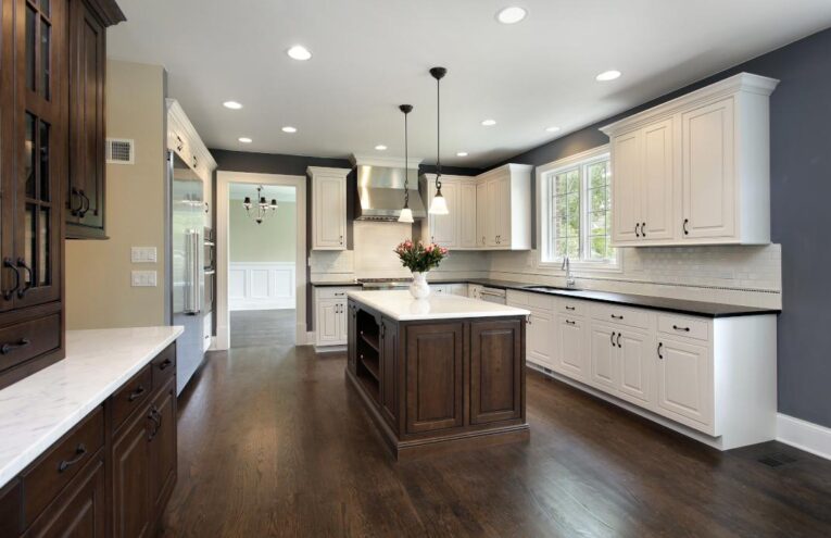 Classic white and brown kitchen with hardwood dark brown flooring