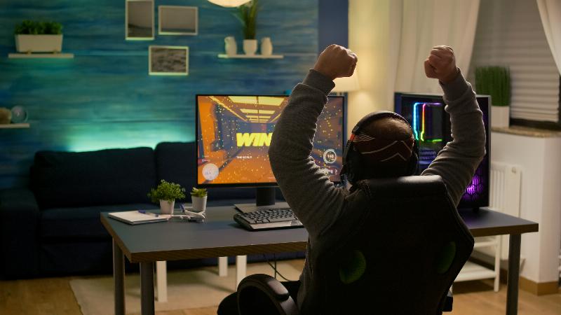 Photo 2: Photo showing gaming room with chairs and neon lighting
