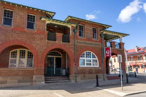 Photo 3: View of the 1896 impressive Queen Anne influenced style two-story masonry building